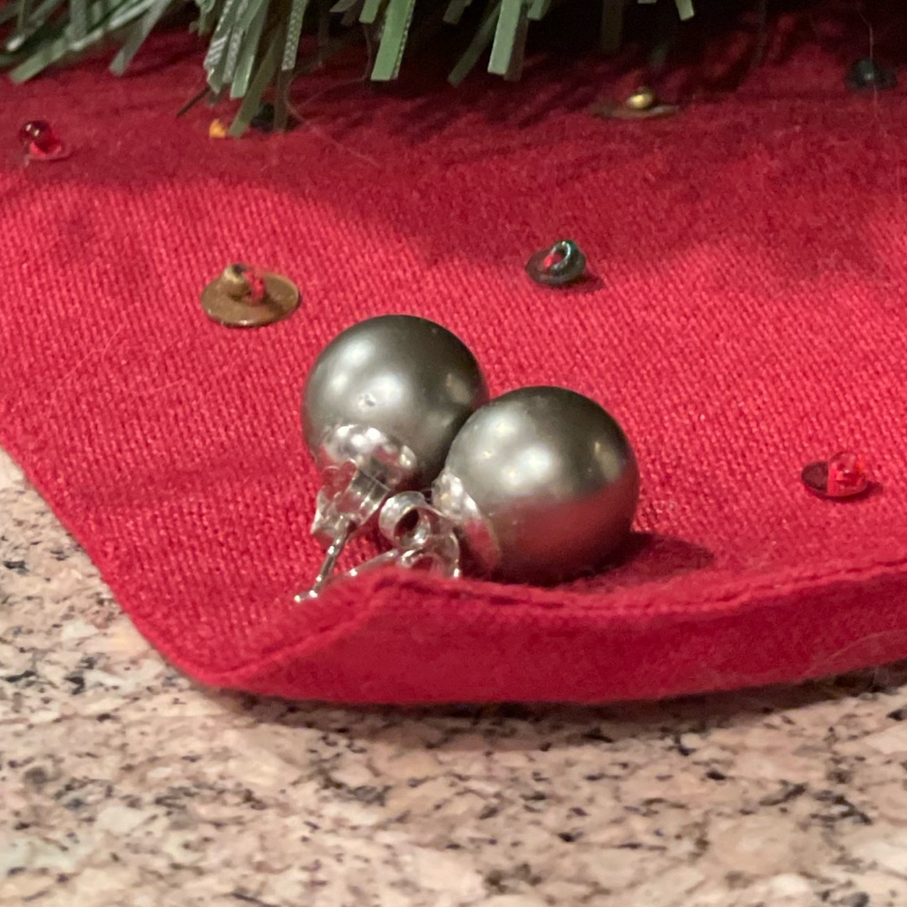 Genuine Tahitian black pearl pierced earrings.